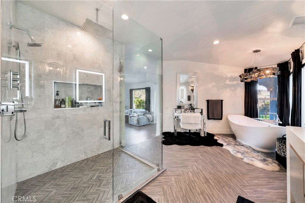 Bathroom, Free Standing Baths, Glass Shower, Interior, Marble Walls, Pendant Lights, Recessed Lighting, Wood Texture Flooring
