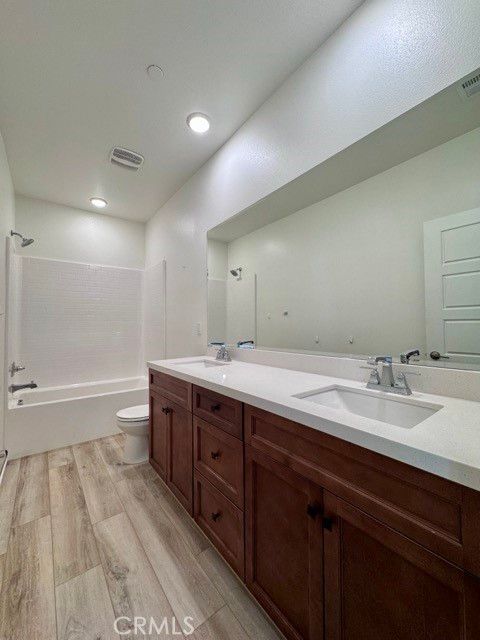 Bathroom, Dual Sink Vanities, Interior, Recessed Lighting, Wood Texture Flooring