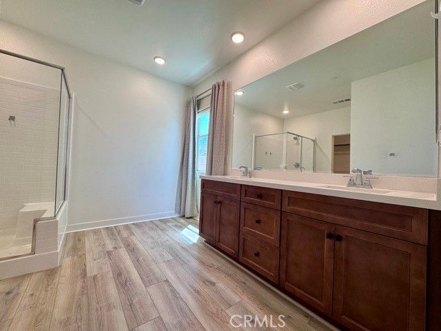Bathroom, Dual Sink Vanities, Interior, Recessed Lighting, Wood Texture Flooring