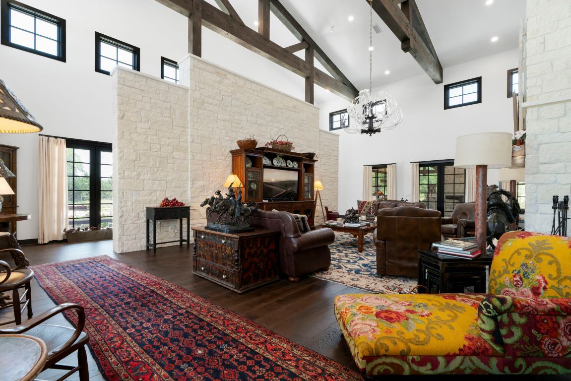 Chandelier, Fireplace, Interior, Living room, Recessed Lighting, Stone Walls, Wooden Beams, Wood Texture Flooring