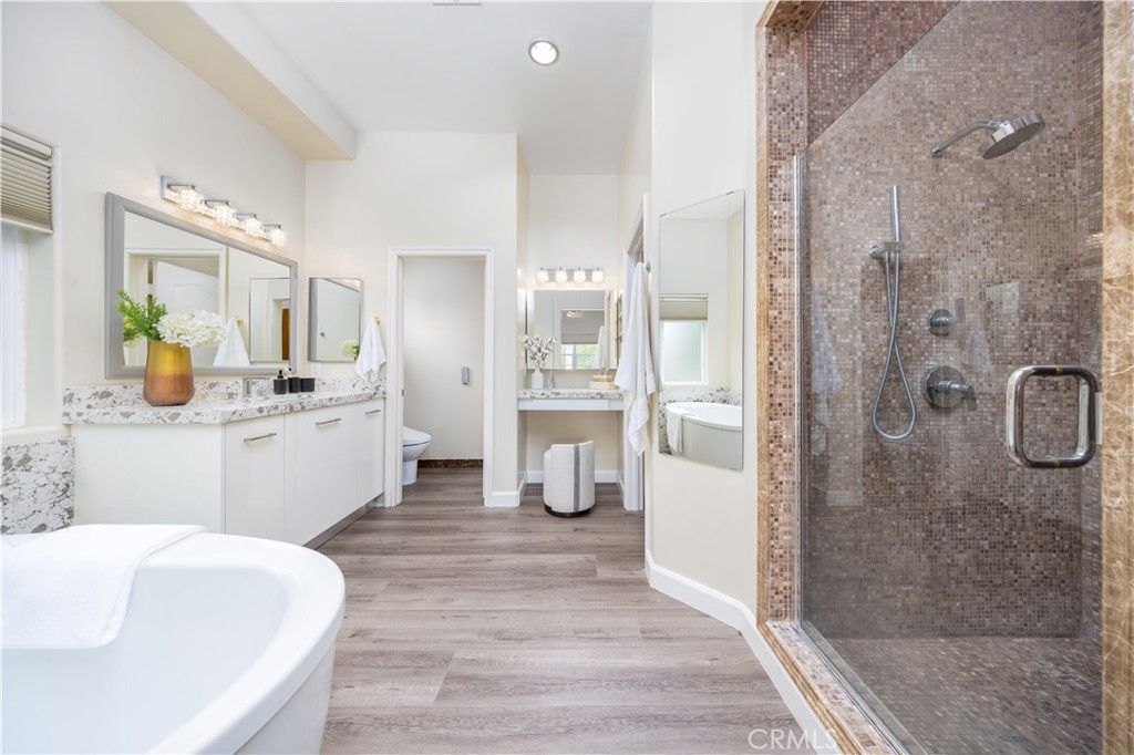 Bathroom, Dual Sink Vanities, Free Standing Baths, Glass Shower, Interior, Recessed Lighting, Wood Texture Flooring