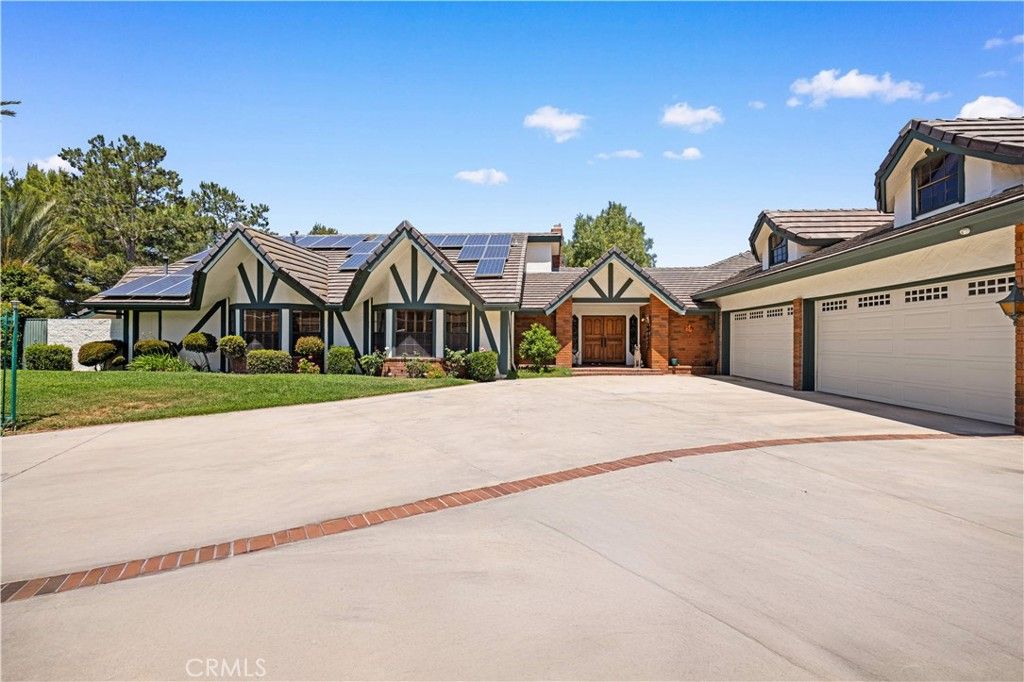 Attached, Exterior, Facade, Solar Panels, Tudor Revival