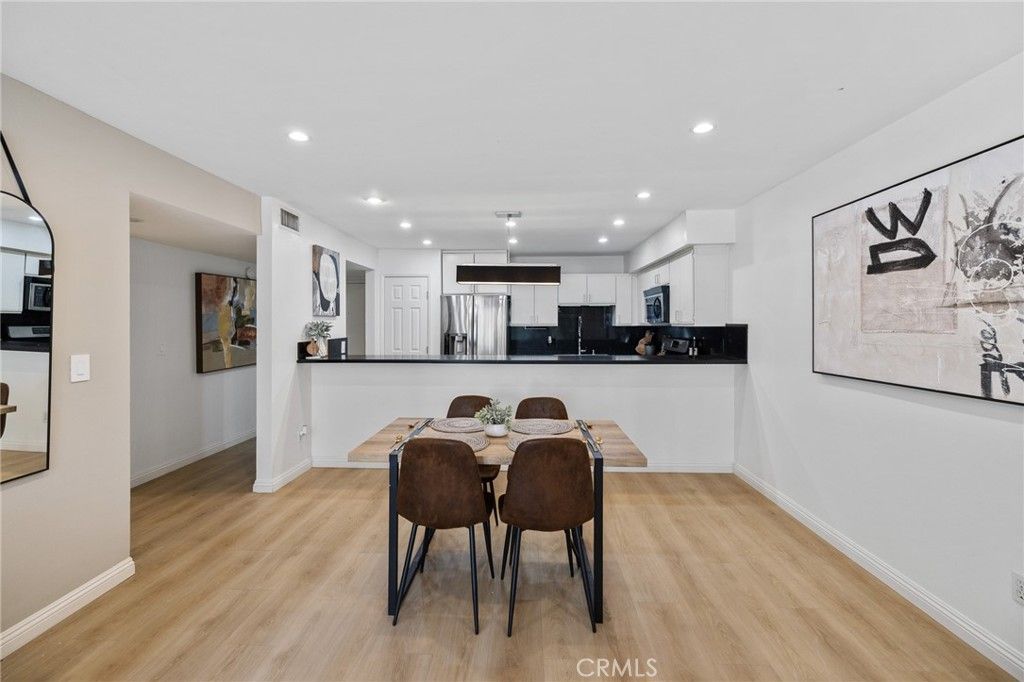 Dining room, Interior, Kitchen, Pendant Lights, Recessed Lighting, Stainless Steel Appliances, Wood Texture Flooring