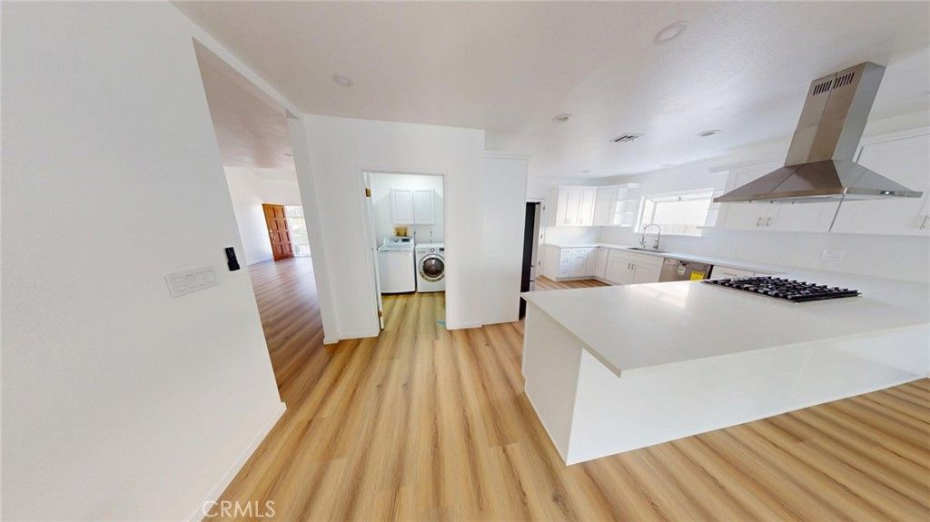 Interior, Kitchen, Recessed Lighting, Washer, Wood Texture Flooring