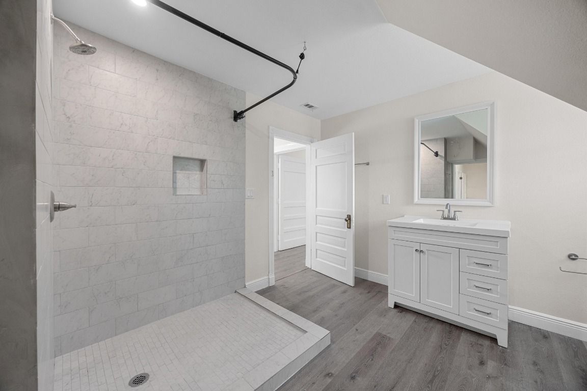 Bathroom, Dual Sink Vanities, Interior, Recessed Lighting, Wood Texture Flooring
