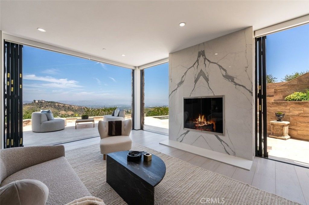 Fireplace, Interior, Living room, Marble Walls, Recessed Lighting, Wood Texture Flooring