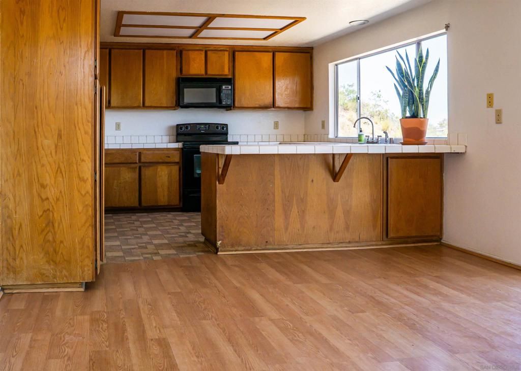 Interior, Kitchen, Tile Countertops, Wood Texture Flooring