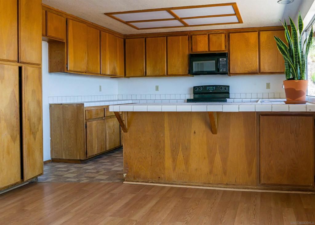 Interior, Kitchen, Tile Countertops, Wood Texture Flooring
