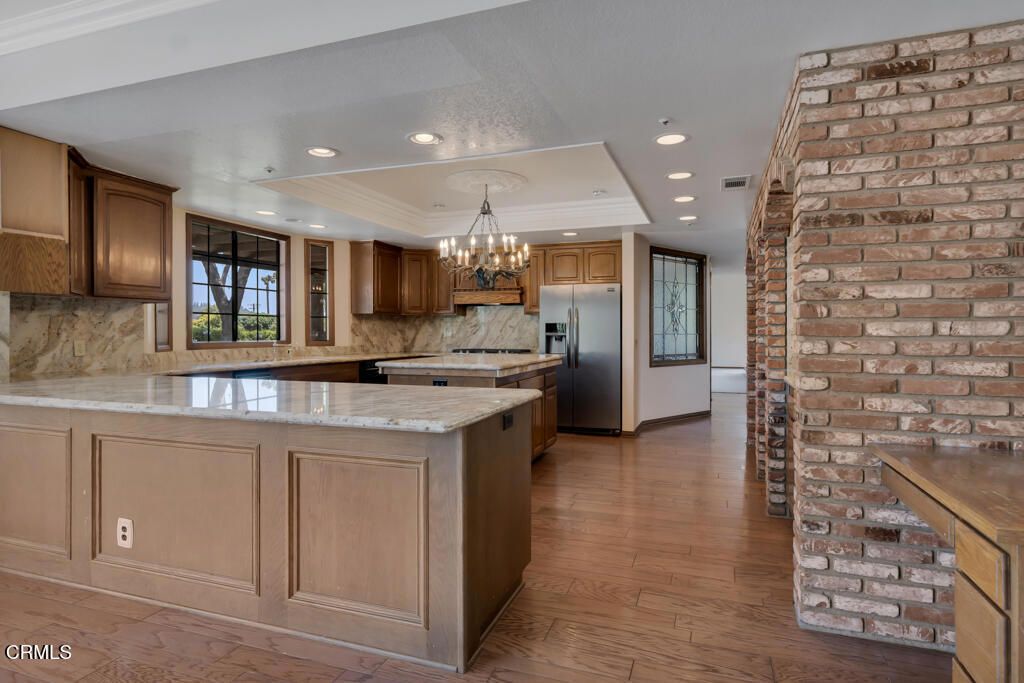 Chandelier, Interior, Kitchen, Recessed Lighting, Stainless Steel Appliances, Stone Walls, Wood Texture Flooring
