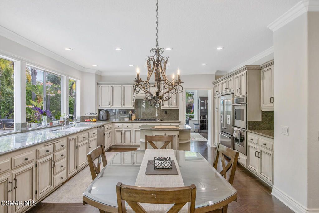 Chandelier, Dining room, Interior, Kitchen, Recessed Lighting, Stainless Steel Appliances, Wood Texture Flooring