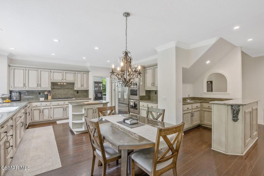 Chandelier, Dining room, Interior, Kitchen, Recessed Lighting, Stainless Steel Appliances, Wood Texture Flooring