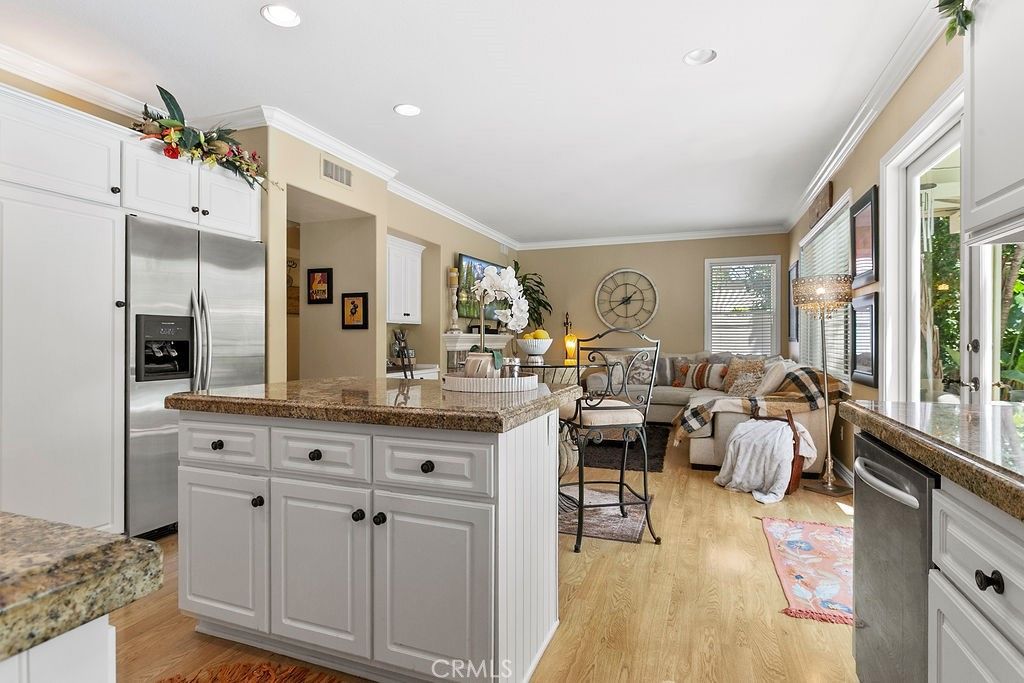 Chandelier, Interior, Kitchen, Living room, Recessed Lighting, Stainless Steel Appliances, Wood Texture Flooring