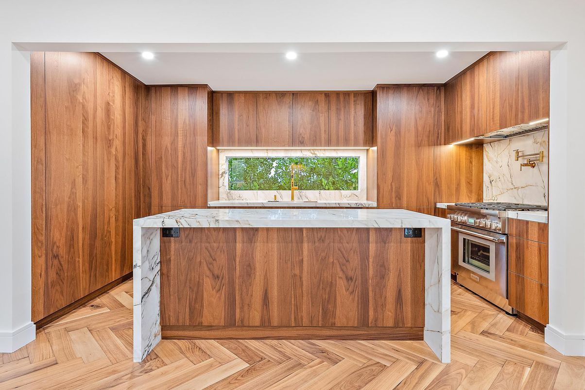 Interior, Kitchen, Marble Walls, Recessed Lighting, Stainless Steel Appliances, Wood Texture Flooring