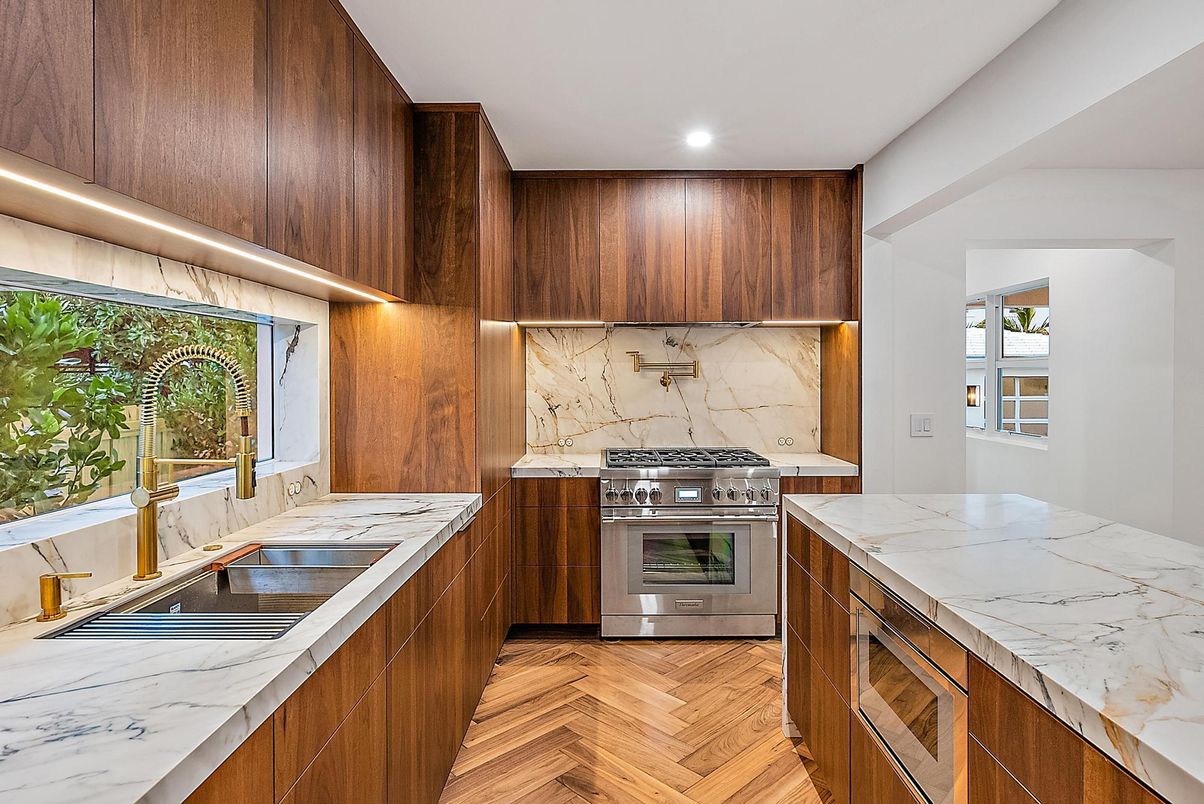 Interior, Kitchen, Marble Walls, Recessed Lighting, Stainless Steel Appliances, Wood Texture Flooring