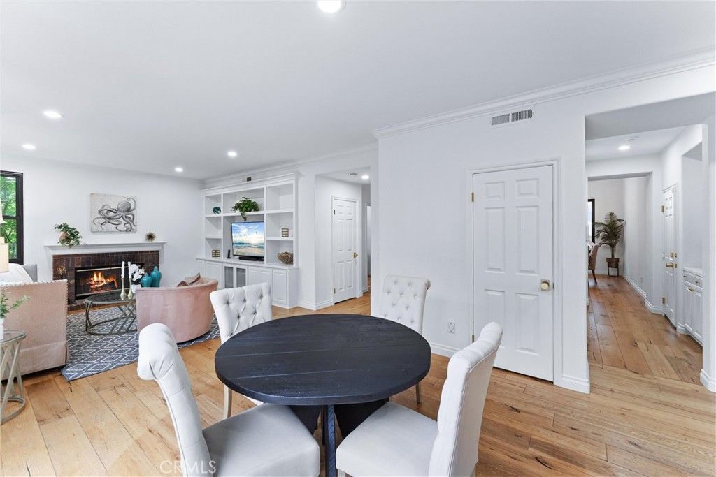 Dining room, Fireplace, Interior, Living room, Recessed Lighting, Wood Texture Flooring