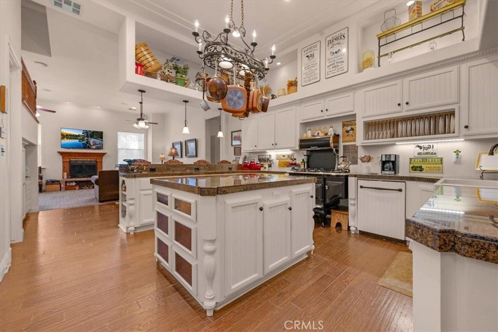 Chandelier, Dining room, Fireplace, Interior, Kitchen, Pendant Lights, Recessed Lighting, Wood Texture Flooring