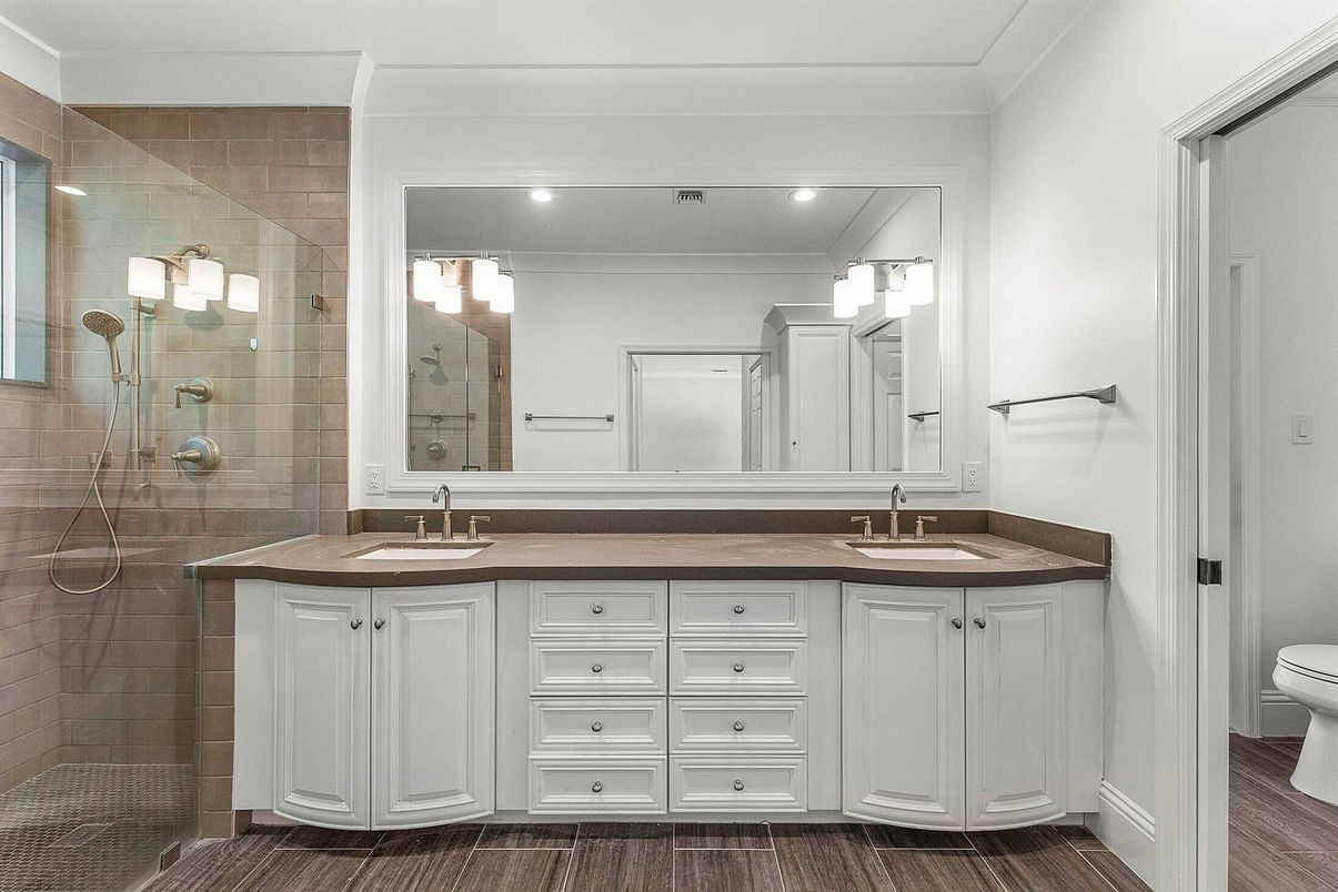 Bathroom, Dual Sink Vanities, Glass Shower, Interior, Recessed Lighting, Wood Texture Flooring