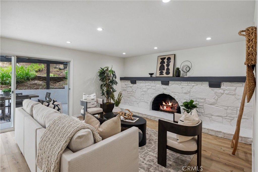 Fireplace, Interior, Living room, Recessed Lighting, Stone Walls, Wood Texture Flooring
