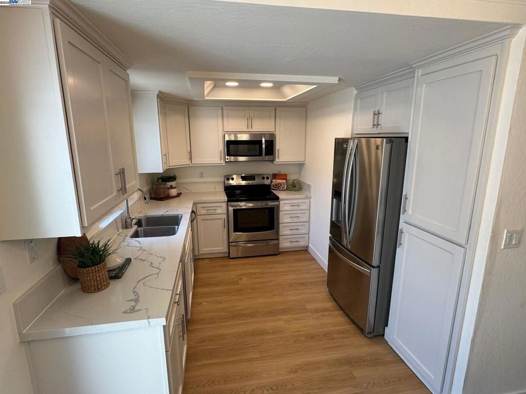 Interior, Kitchen, Recessed Lighting, Stainless Steel Appliances, Wood Texture Flooring