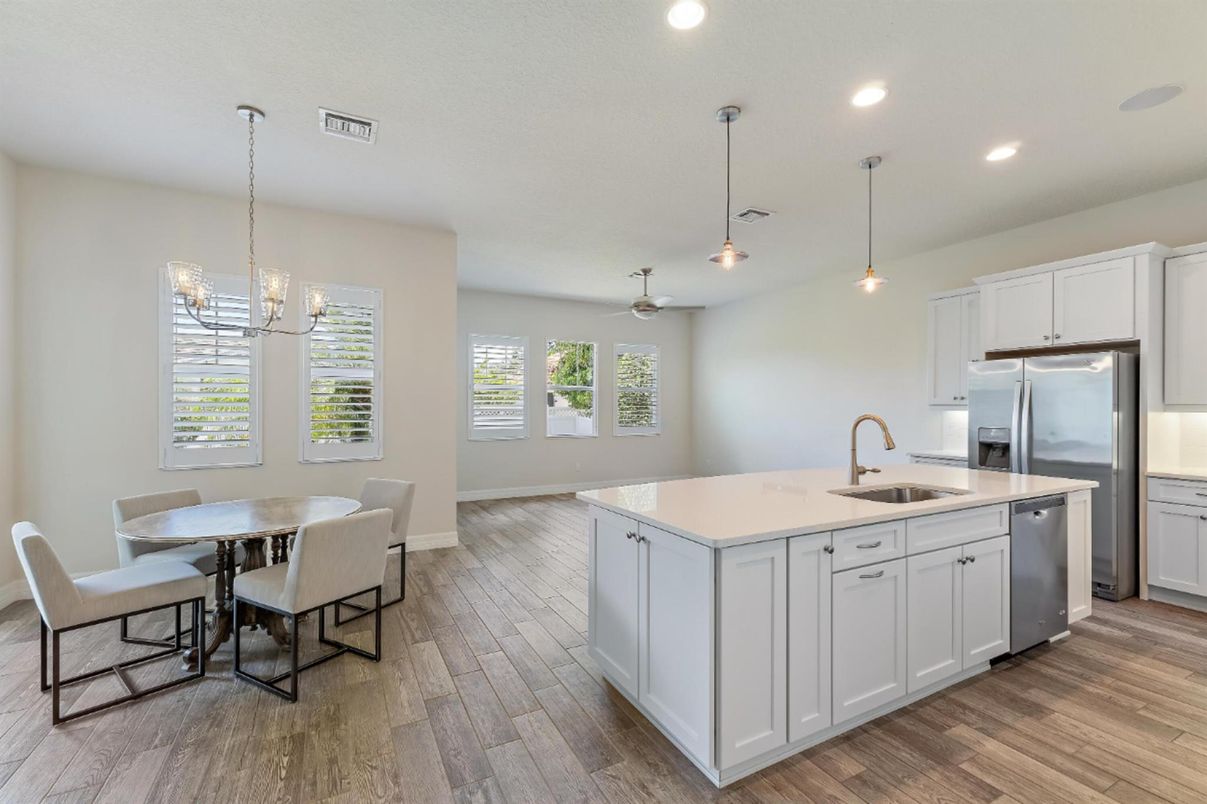 Dining room, Interior, Kitchen, Pendant Lights, Recessed Lighting, Stainless Steel Appliances, Wood Texture Flooring