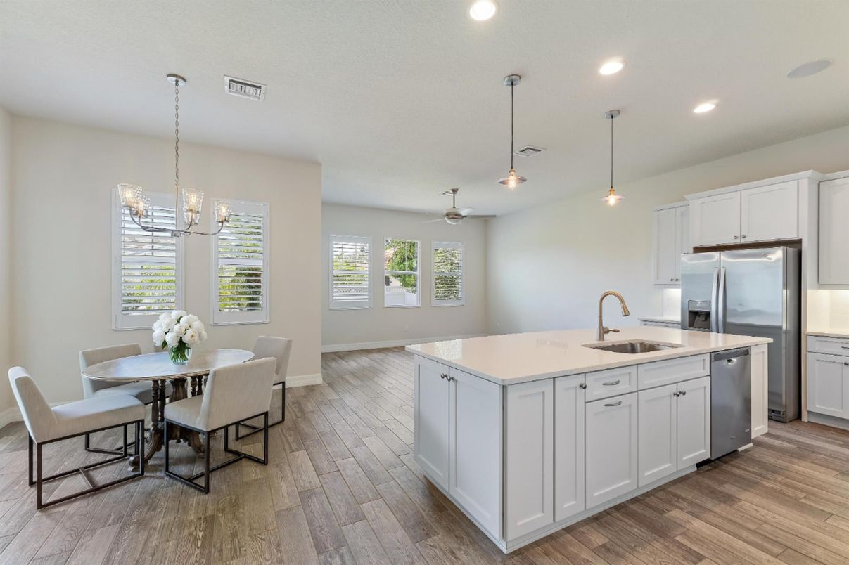 Dining room, Interior, Kitchen, Pendant Lights, Recessed Lighting, Stainless Steel Appliances, Wood Texture Flooring