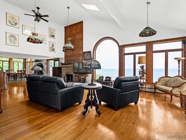 Dining room, Fireplace, Interior, Living room, Pendant Lights, Water, Wood Texture Flooring