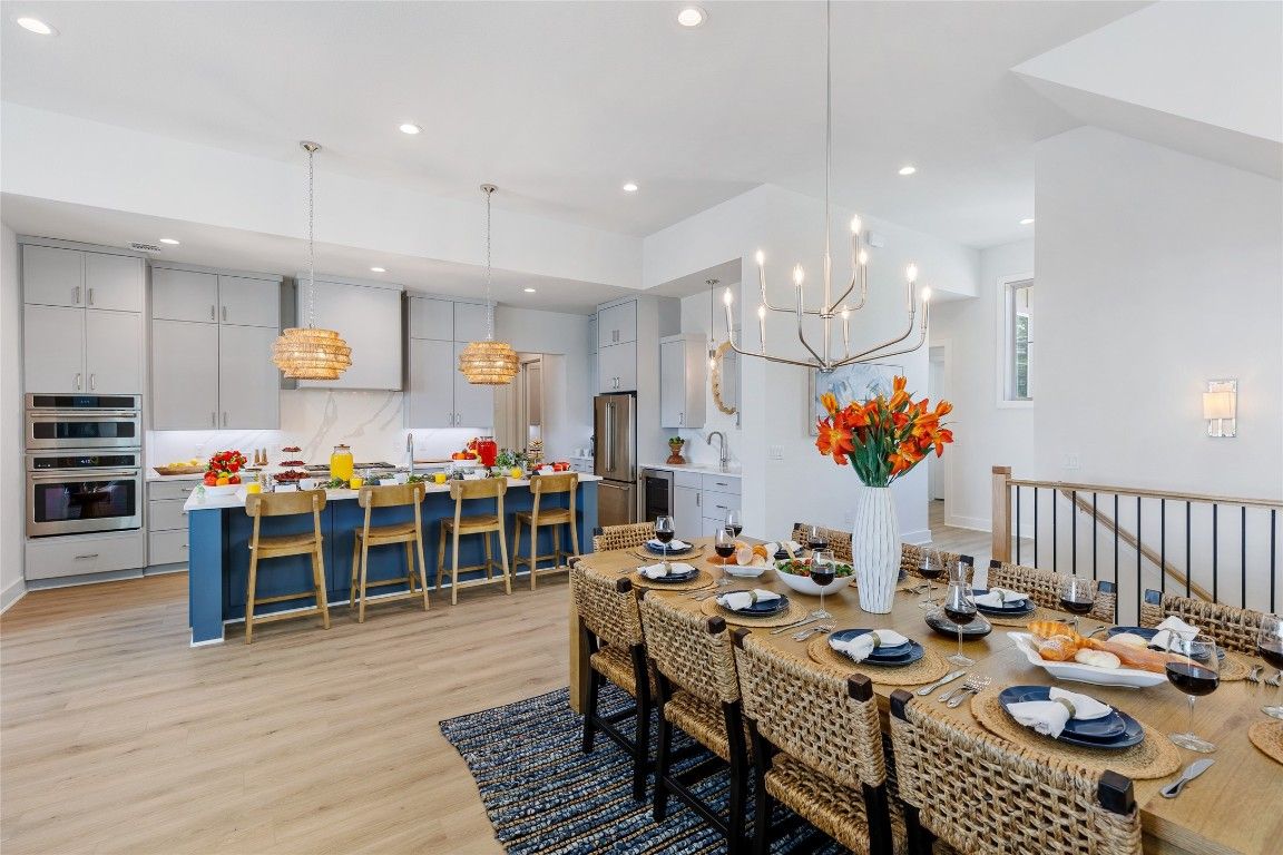 Chandelier, Dining room, Interior, Kitchen, Pendant Lights, Recessed Lighting, Stainless Steel Appliances, Wood Texture Flooring