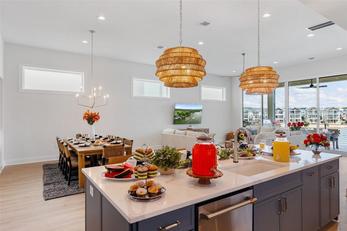 Chandelier, Dining room, Interior, Kitchen, Living room, Pendant Lights, Recessed Lighting, Stainless Steel Appliances, Wood Texture Flooring