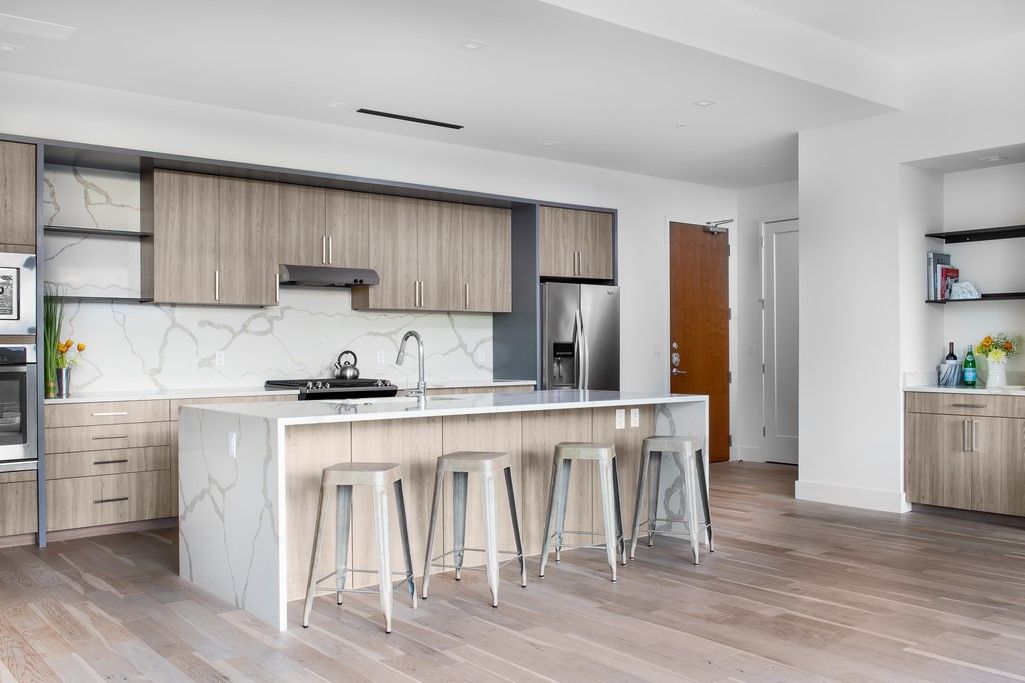Interior, Kitchen, Marble Walls, Recessed Lighting, Stainless Steel Appliances, Wood Texture Flooring
