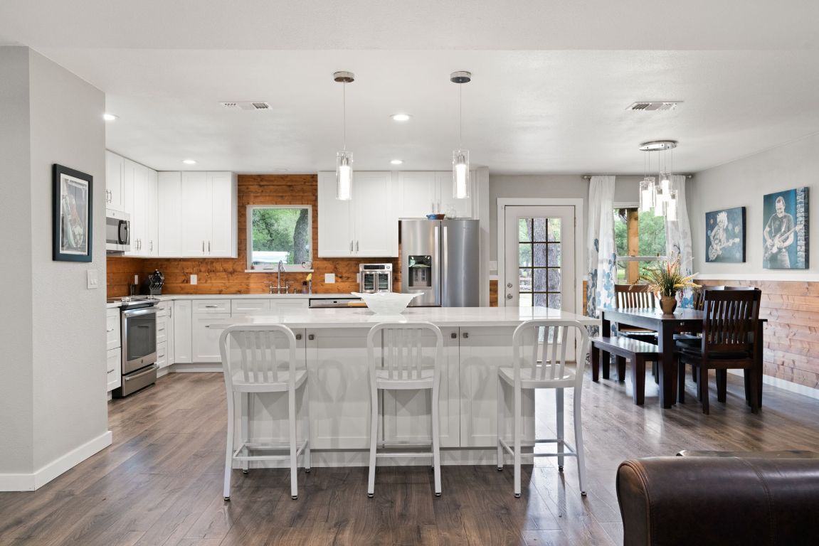 Dining room, Interior, Kitchen, Pendant Lights, Recessed Lighting, Stainless Steel Appliances, Wood Texture Flooring