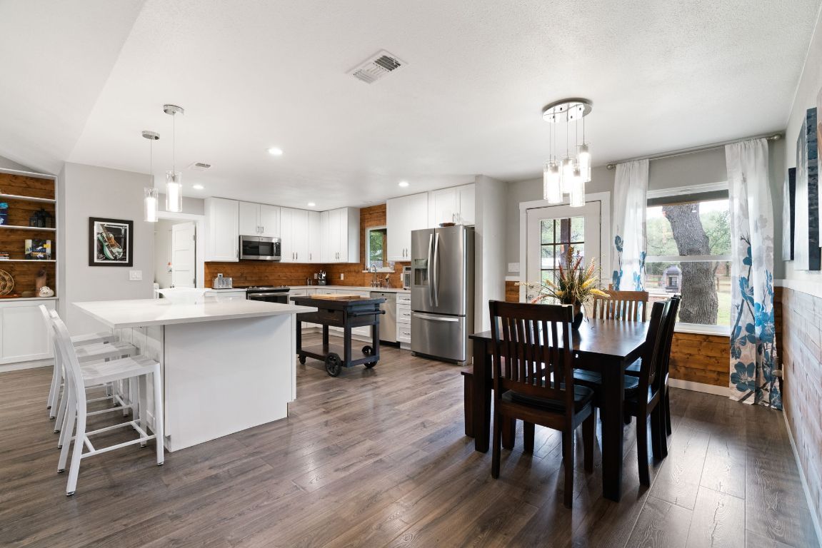 Dining room, Interior, Kitchen, Pendant Lights, Recessed Lighting, Stainless Steel Appliances, Wood Texture Flooring