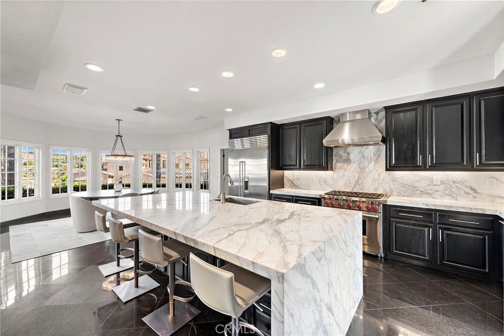 Interior, Kitchen, Marble Walls, Pendant Lights, Recessed Lighting, Stainless Steel Appliances