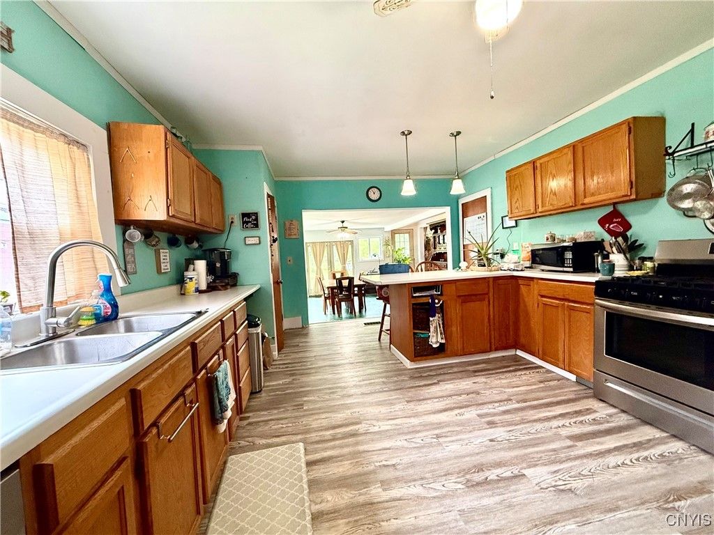 Interior, Kitchen, Pendant Lights, Tile Countertops, Wood Texture Flooring