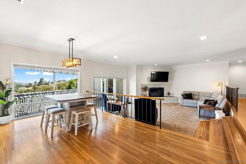 Dining room, Fireplace, Interior, Living room, Pendant Lights, Recessed Lighting, Wood Texture Flooring