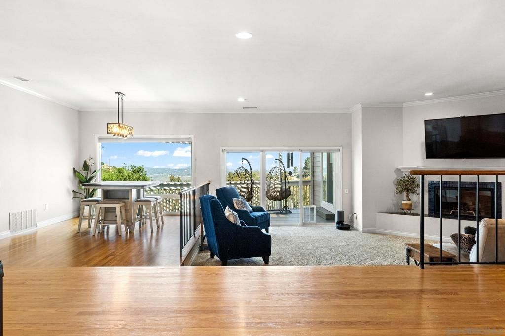 Dining room, Fireplace, Interior, Living room, Pendant Lights, Recessed Lighting, Wood Texture Flooring