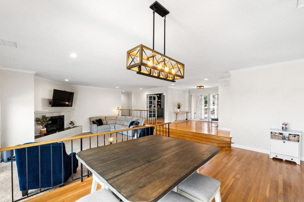 Dining room, Fireplace, Interior, Living room, Pendant Lights, Recessed Lighting, Wood Texture Flooring