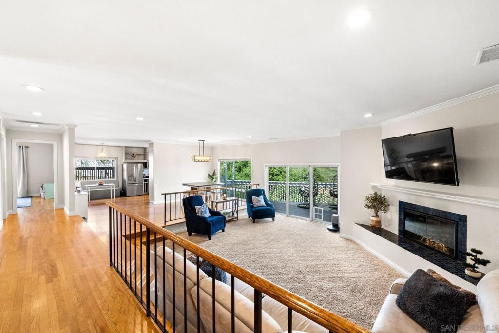 Fireplace, Interior, Kitchen, Living room, Pendant Lights, Recessed Lighting, Stainless Steel Appliances, Wood Texture Flooring