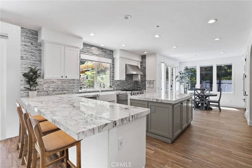 Dining room, Interior, Kitchen, Recessed Lighting, Stainless Steel Appliances, Wood Texture Flooring