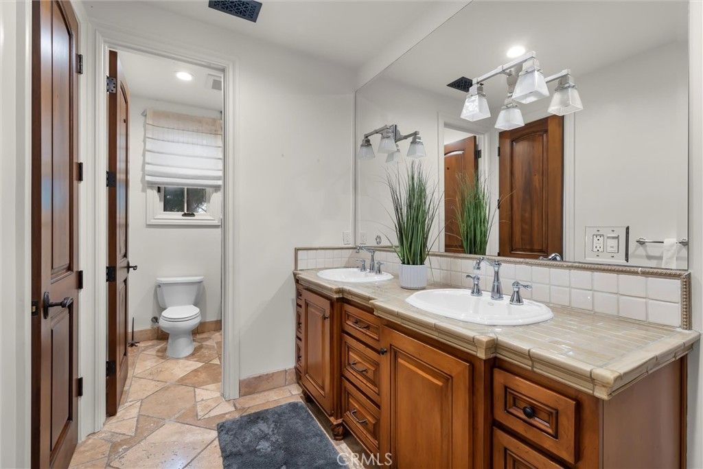 Bathroom, Dual Sink Vanities, Interior, Recessed Lighting, Tile Countertops