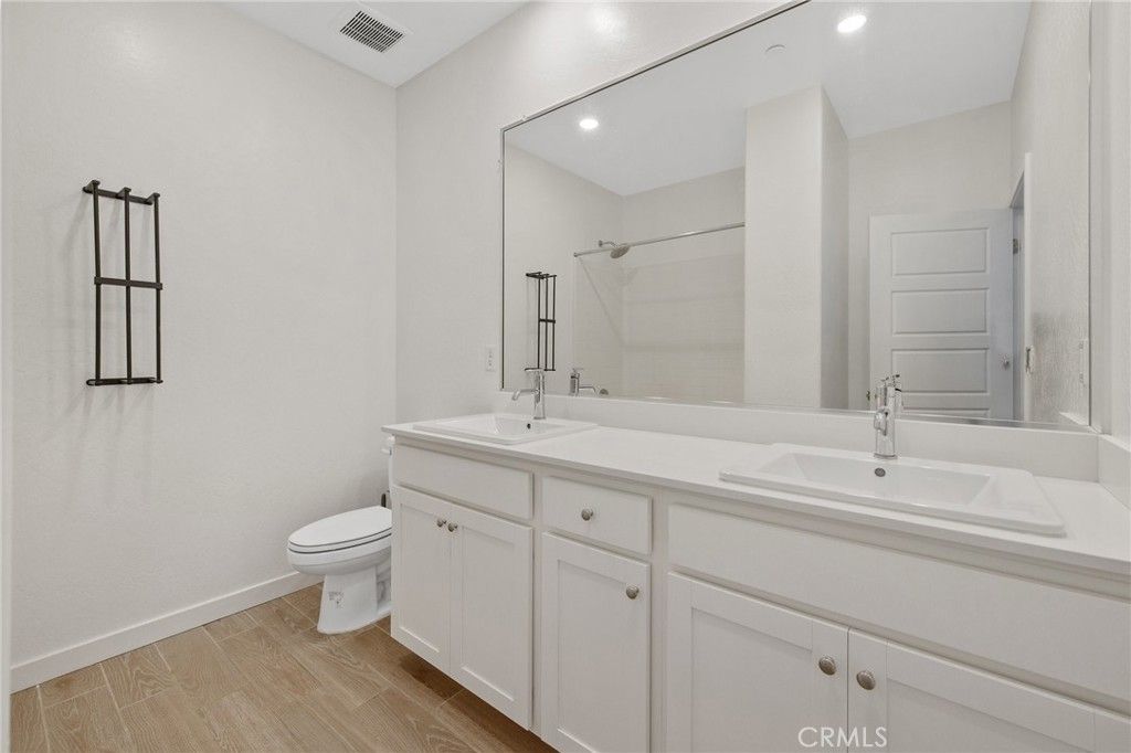 Bathroom, Dual Sink Vanities, Interior, Recessed Lighting, Wood Texture Flooring
