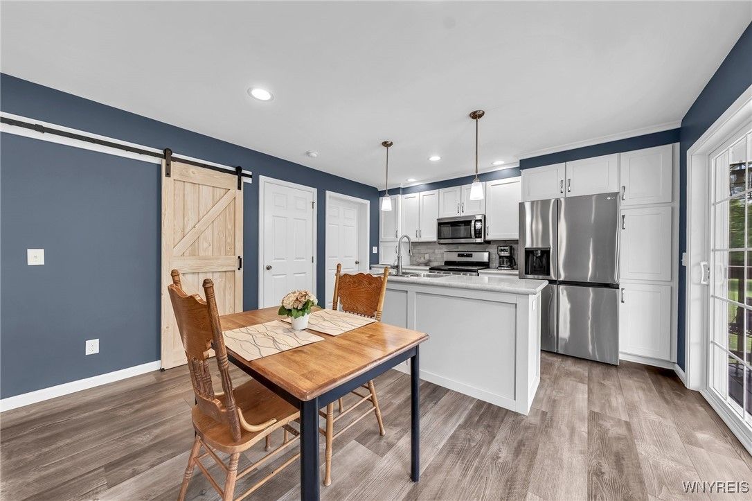 Dining room, Interior, Kitchen, Pendant Lights, Recessed Lighting, Stainless Steel Appliances, Wood Texture Flooring