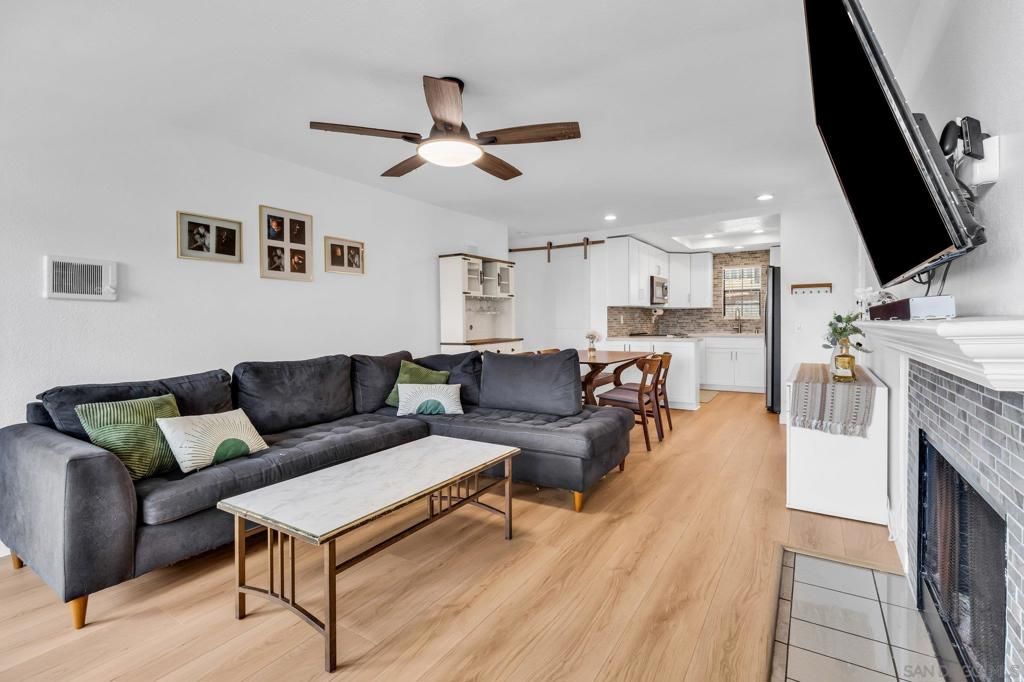 Dining room, Fireplace, Interior, Kitchen, Living room, Recessed Lighting, Wood Texture Flooring