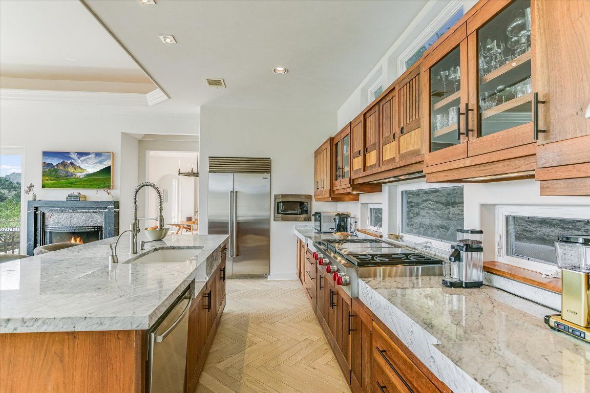 Fireplace, Interior, Kitchen, Recessed Lighting, Stainless Steel Appliances, Wood Texture Flooring