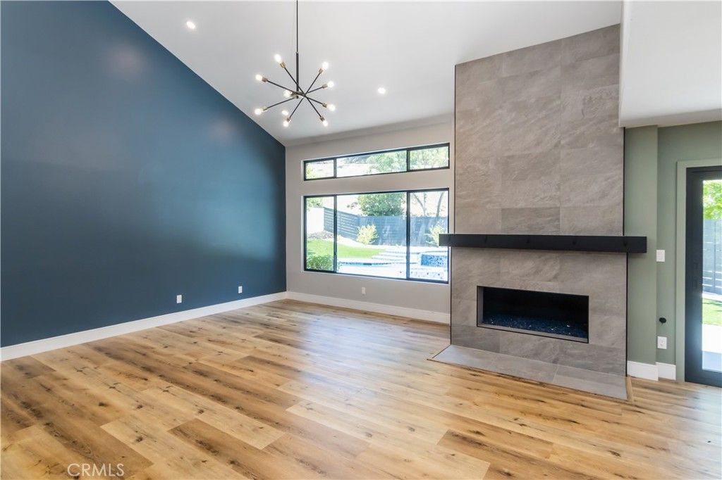Empty room, Fireplace, Interior, Pendant Lights, Recessed Lighting, Wood Texture Flooring