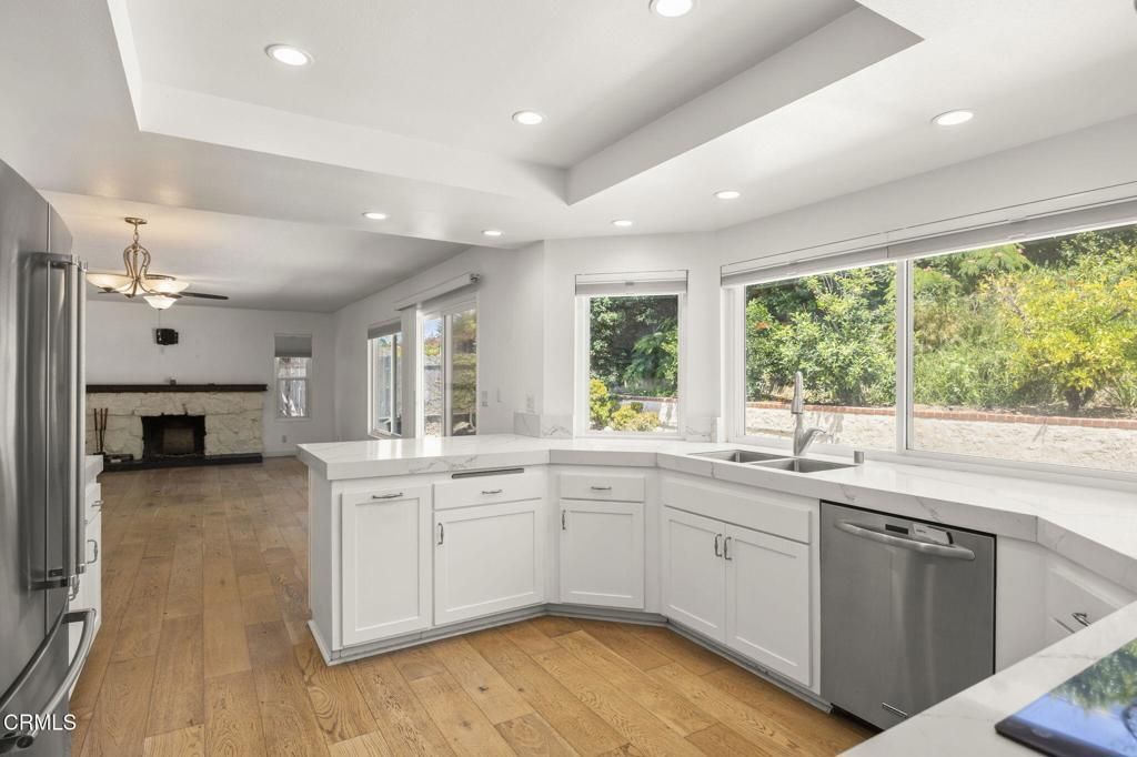 Fireplace, Interior, Kitchen, Recessed Lighting, Stainless Steel Appliances, Wood Texture Flooring