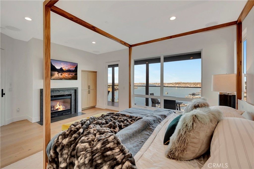 Bedroom, Fireplace, Interior, Recessed Lighting, Water, Wood Texture Flooring