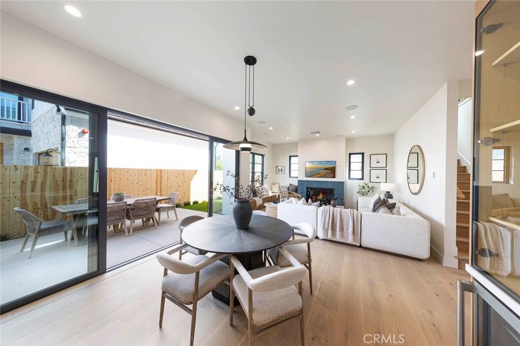 Dining room, Fireplace, Interior, Living room, Pendant Lights, Recessed Lighting, Wood Texture Flooring