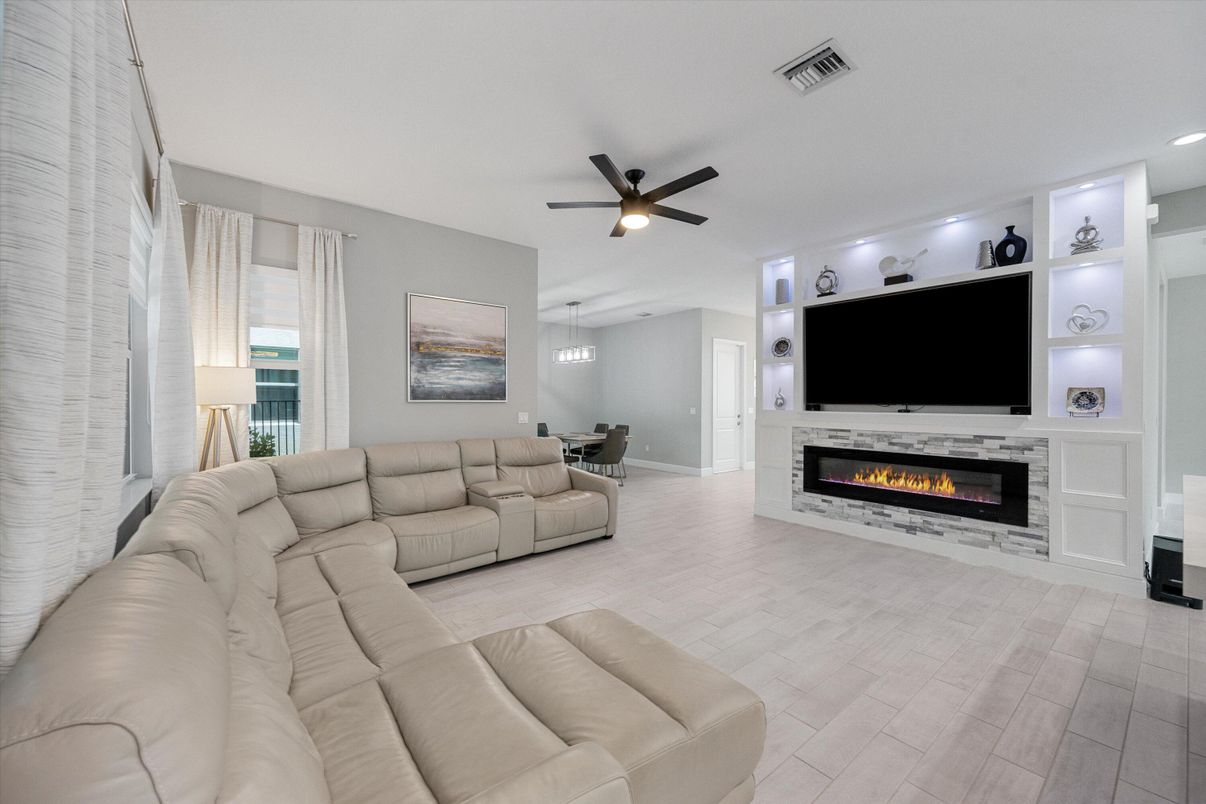 Dining room, Fireplace, Interior, Living room, Recessed Lighting, Wood Texture Flooring