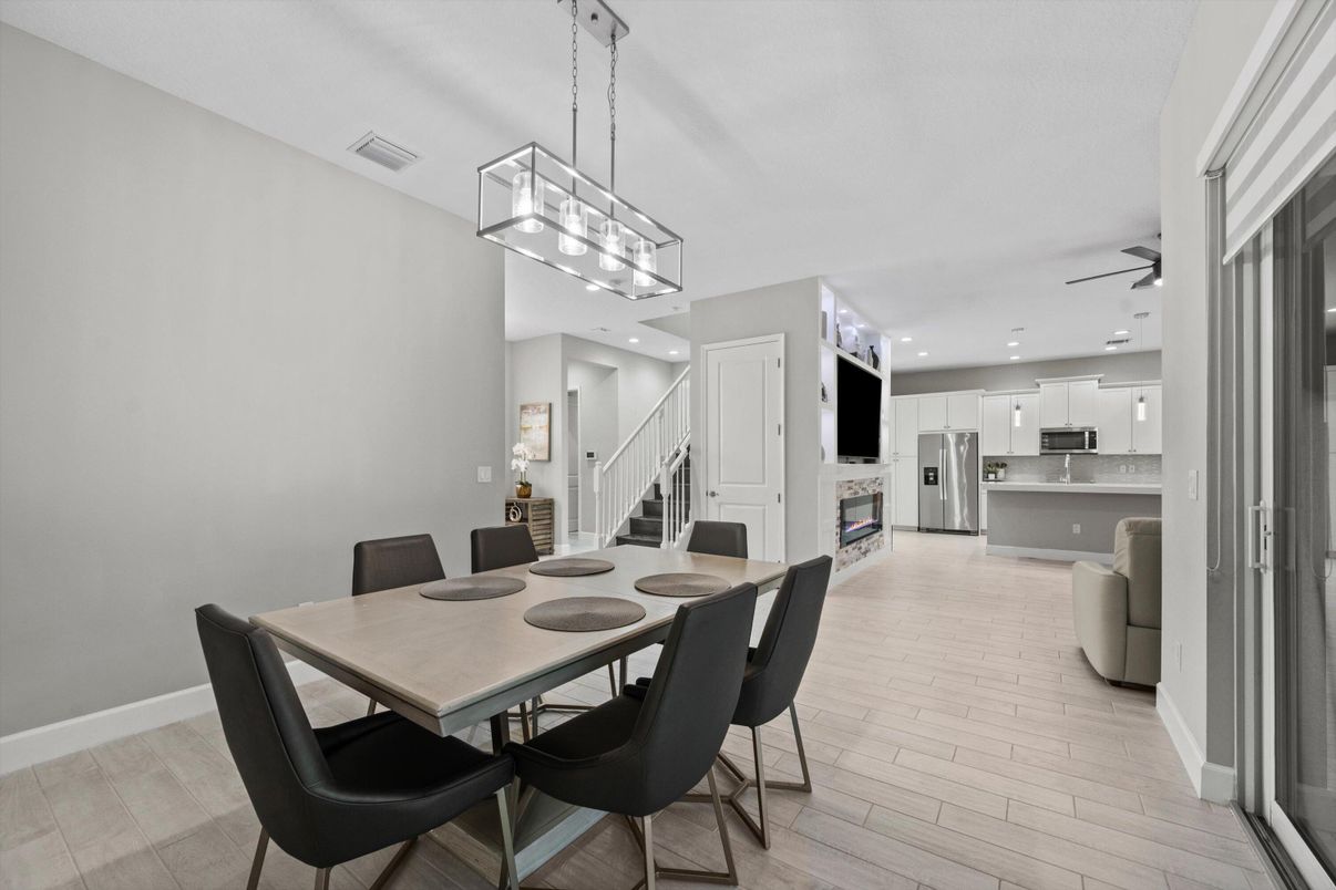 Dining room, Interior, Kitchen, Pendant Lights, Recessed Lighting, Stainless Steel Appliances, Wood Texture Flooring
