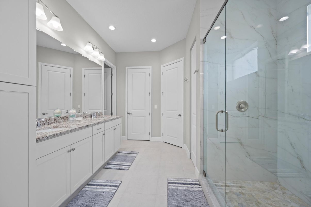 Bathroom, Dual Sink Vanities, Glass Shower, Interior, Marble Walls, Recessed Lighting